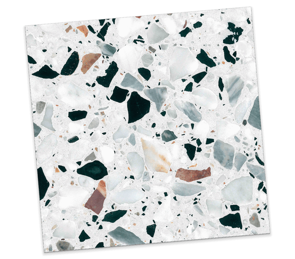 Detailed view of terrazzo tile sample with green and neutral stone chips from La Tuilerie anniversary collection