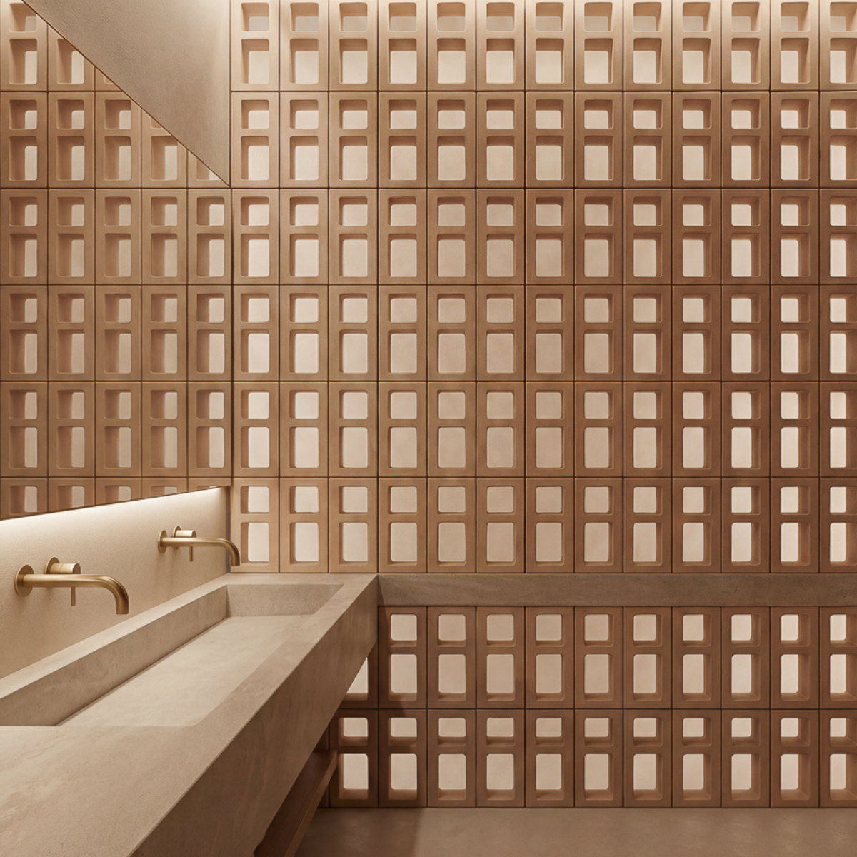 Mur en claustra intérieur dans une salle de bain créant une zone plus intime autour de la vanité tout en conservant une impression d’ouverture.